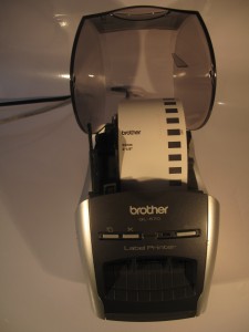 Brother QL-570 thermal label printer tape compartment with tape