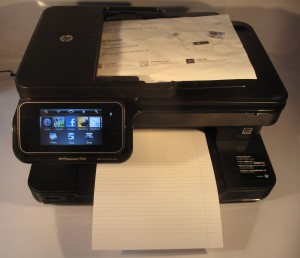 HP Photosmart 7510 multifunction inkjet printer with paper in scanner and output