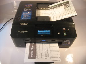 Brother DCP-J925DW multi-function printer with paper loaded