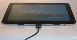 HP Envy X2 main tablet unit connected to the charger