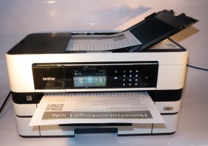 Brother MFC-J410DW sideways-print multifunction inkjet printer - loaded deck view with lengthways document output