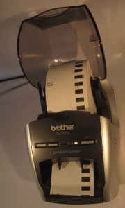 Brother QL-570 thermal label printer tape path shown