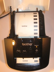 Brother QL-700 label printer with tape loaded