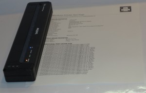 Brother PJ-773 Wireless Mobile Thermal Printer alongside Windows test printout that it printed