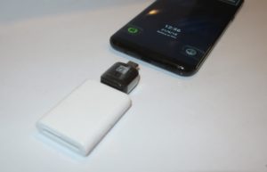Memory card reader connected to USB-C adaptor for Samsung Galaxy S8 Plus smartphone