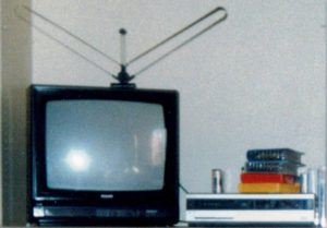 TV, VHS videocassette recorder and rented video movies